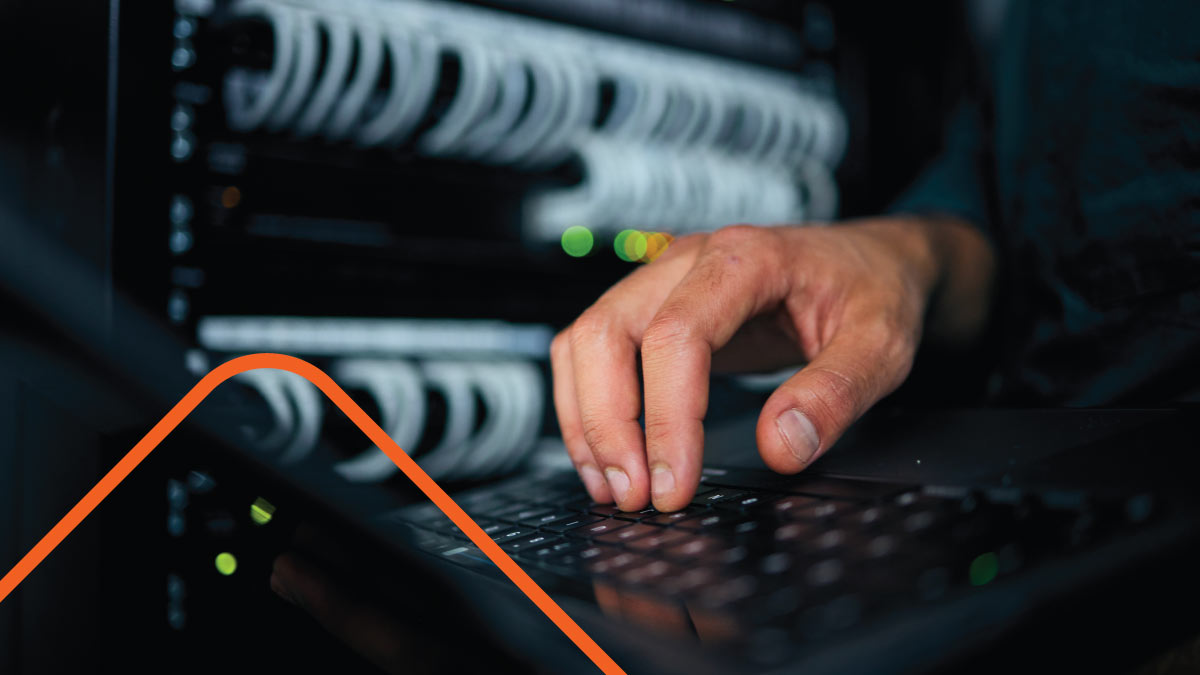 Close-up of person's hand working on server maintenance